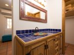Beautiful painted sink and tiled countertop 